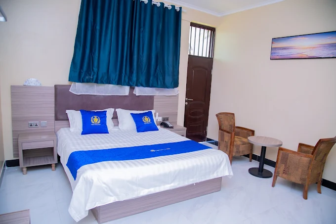 Double Rooms: Furnished with standard bedding options, a work desk, a separate sitting space, and a wardrobe closet.